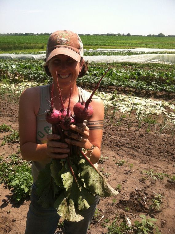 Author Elizabeth Millard, or 'Bossy E,' doing some outdoors farming.