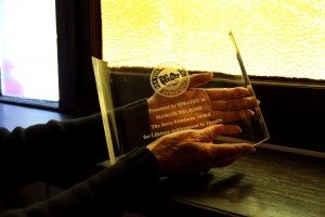 Margie Belrose holds her Jerry Friedman Lifetime Achievement Award. Photo by Molly Oleson