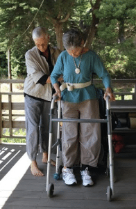 Grace Dammann gets rehabilitation help from her partner, Nancy "Fu" Schroeder.