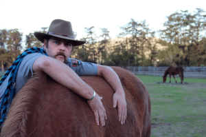 Phil Straub embraces Elvis at the Morgan Horse Ranch. Photo by Molly Oleson.