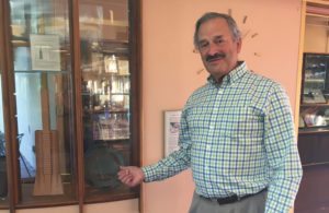 Bill Schwarz stands in front of a window of the former Marin County Gift Shop that he designed. It now houses a mini-museum. Photo by Lily O'Brien. 