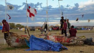 For several months, indigenous people, environmentalists and Great Plains residents have protested the Dakota Access Pipeline. This photo is a production still from the upcoming documentary 'Layin' the Pipe' by Caitlin Kazepis. Photo by Caitlin Kazepis.