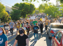 Mayor pledges review, increases police budget