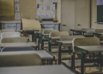 State Officials Announce $6.6B Deal to Reopen Schools Statewide School desks Unsplash
