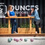 Photo provided by Waz Hewerdine PAIRINGS Two patrons of the Ounces Outdoors soft opening enjoy a brew and a game of bocce.