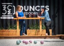Photo provided by Waz Hewerdine PAIRINGS Two patrons of the Ounces Outdoors soft opening enjoy a brew and a game of bocce.