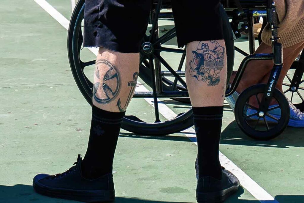 Ron Greene TROUBLING IMAGERY Close up of an Urban Alchemy employee’s tattoos with white supremacist symbols.