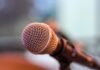 Northerly Neighbor: Canada Rejects U.S. ‘Ownership’ Microphone on a small stand.