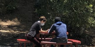 A chaplain from The Street Chaplaincy in Marin offers spiritual support to a homeless person in San Rafael.