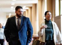 San Rafael cop found not guilty of felony charges is with his criminal defense attorney.