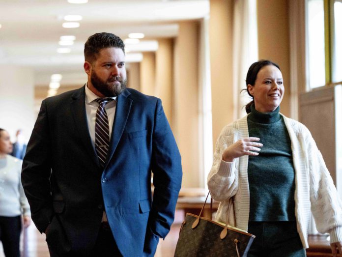 San Rafael cop found not guilty of felony charges is with his criminal defense attorney.