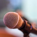 Strategy of Strife: When Diplomacy Becomes Part of the War A microphone on a small stand.