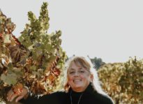 Debra Mathy, owner of Dutcher Crossing Winery in vineyard
