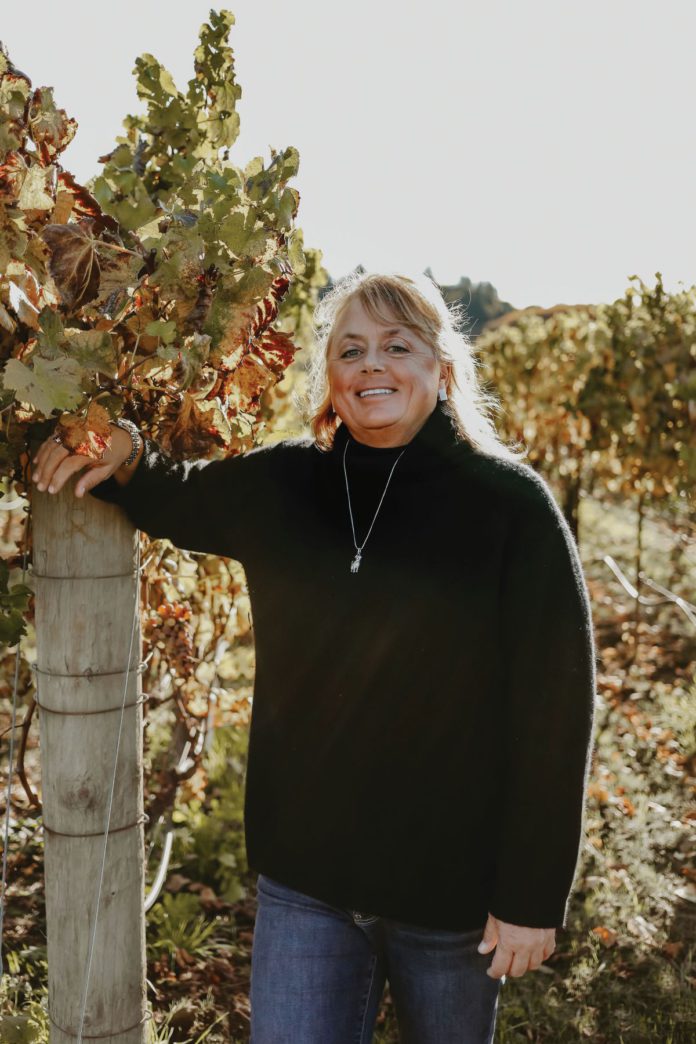 Debra Mathy, owner of Dutcher Crossing Winery in vineyard