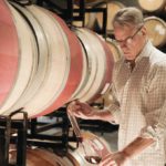 Lauded Legacy: Courtney Benham Reignites a Wine Icon Courtney Benham of CMB Family of Wines pours a glass of wine from a barrel.
