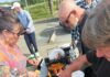 Homeless camp residents break bread together with their housed neighbors at weekly dinners.