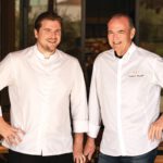 Reed Palmer and Charlie Palmer in white chef coats.