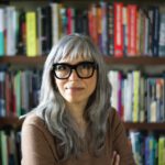 Technothriller: What a ‘Maligned Little Subgenre’ Tells Us About Our Tech Age Soraya Murray, author and film scholar, photographed in front of books on shelves.