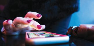 Woman using a dating app on a smartphone.