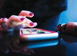 Woman using a dating app on a smartphone.