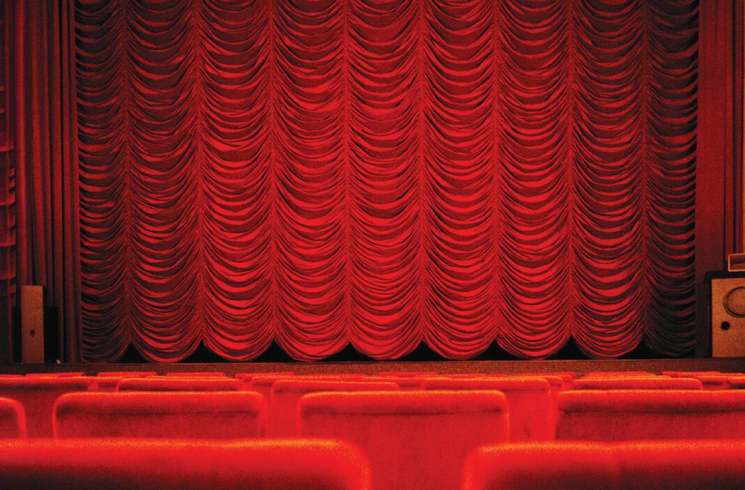 A closed red theater curtain