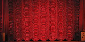 A closed red theater curtain