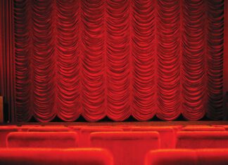 A closed red theater curtain