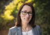 Peak Meals: Butter, Eggs and Salsa with Amy Svendberg Amy Svendberg smiling outdoors in a white top and grey blazer with greenery behind her