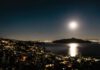 Full moon shining over the Marin landscape and water.