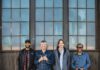 North Mississippi Allstars members standing in front of a building,