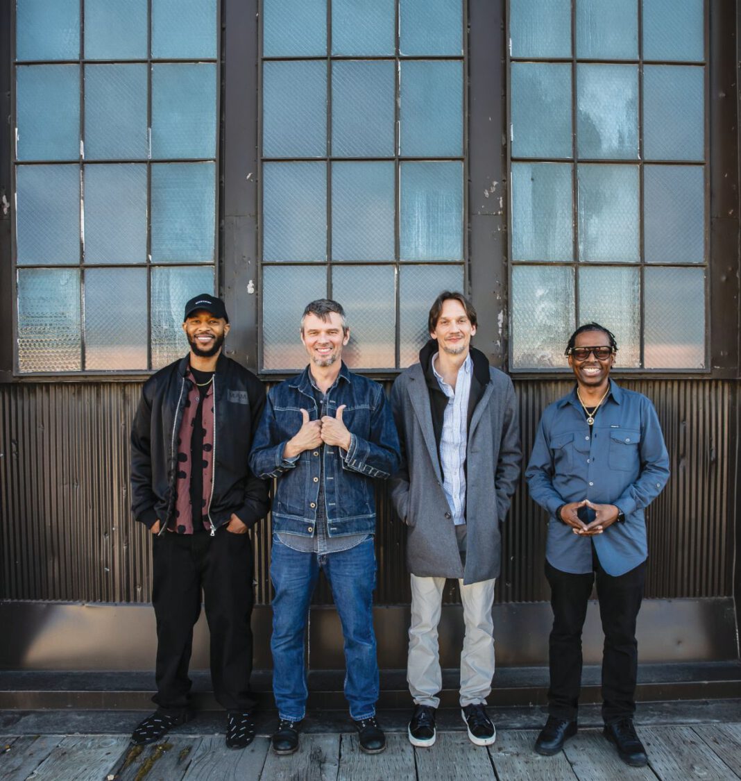 North Mississippi Allstars members standing in front of a building,