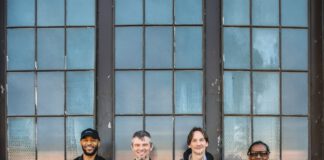 North Mississippi Allstars members standing in front of a building,