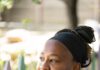 Beyond the Meal: Kieawnie Clar’s Fight for Dignity and Belonging Kieawnie Clar in an outdoor setting, wearing a black headband and black top with white trim
