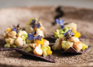 Season to Taste: Dee Wagner Gets Real About ‘Farm-to-Table’ Pink shrimp ceviche with diced mango served on two blue corn tortilla chips.